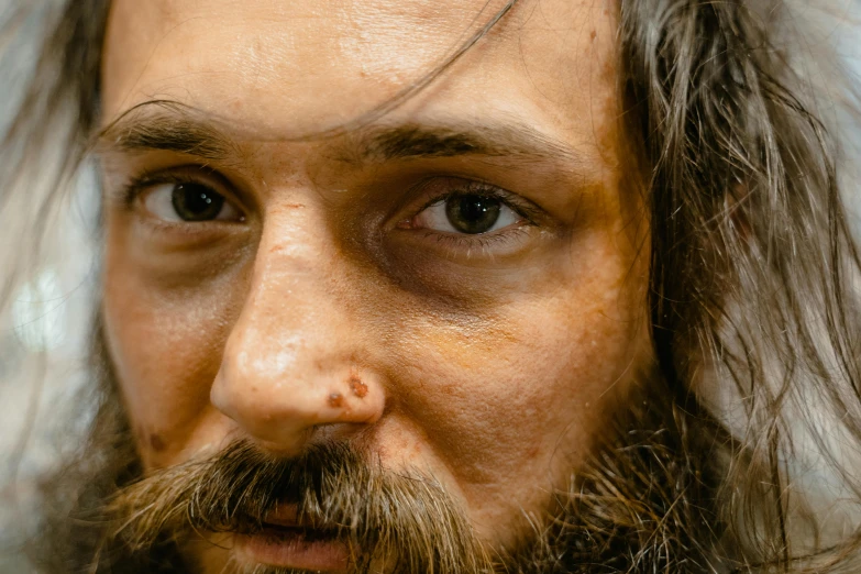 a close up of a man with long hair and a beard, hyperrealism, bruised, meet the actor behind the scenes, full face view, holes in a religious man