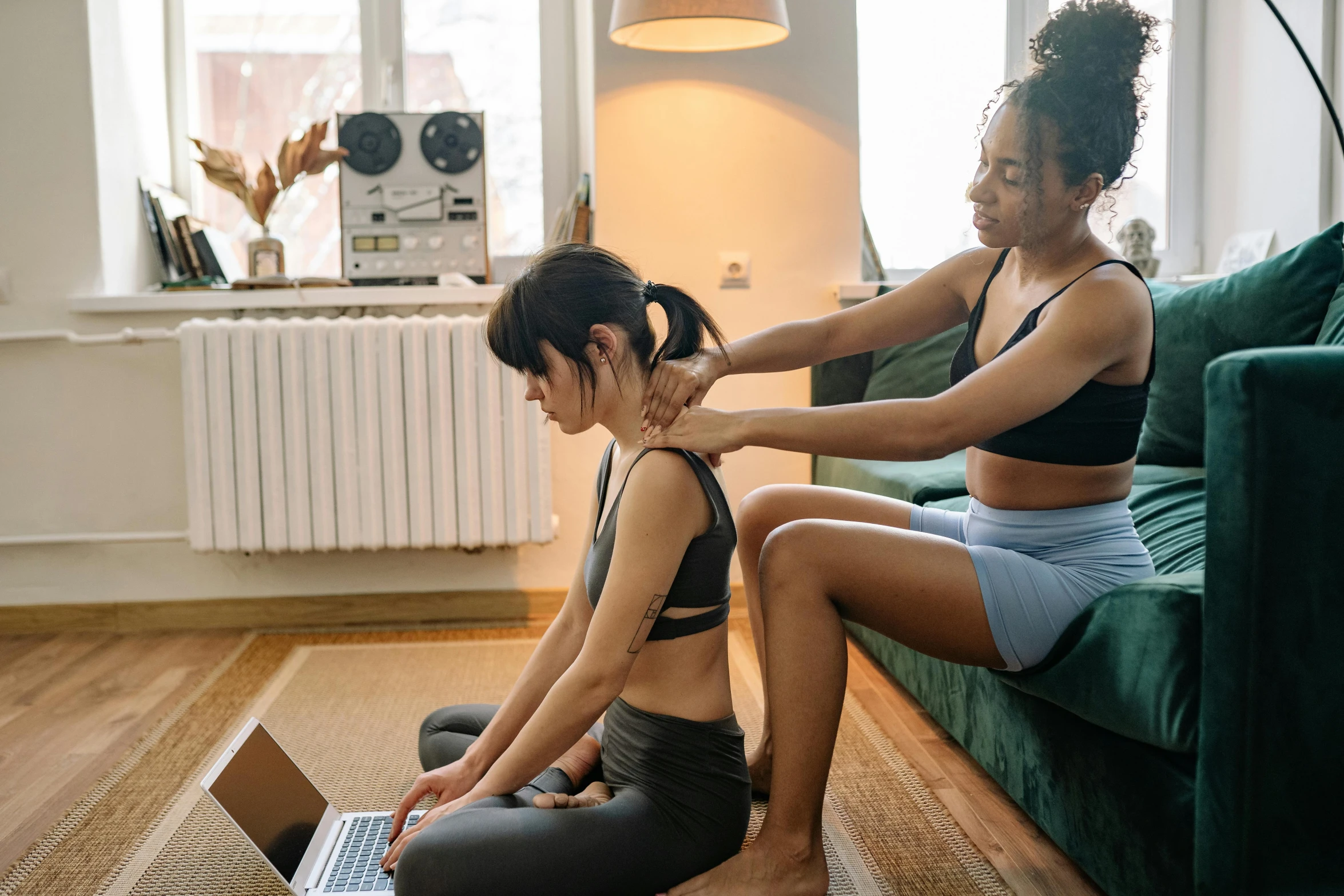 two women sitting on a couch with a laptop, by Niko Henrichon, trending on pexels, renaissance, acupuncture treatment, showing her shoulder from back, pixel stretching, sydney park