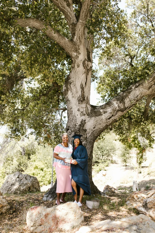 a man and a woman standing under a tree, a portrait, unsplash, aida muluneh, california, preserved historical, lesbian