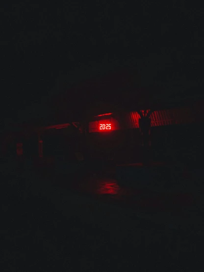 a red light that is on in the dark, an album cover, inspired by Elsa Bleda, unsplash, postminimalism, year 2 5 0 0, countdown, flooded station, 2 k aesthetic