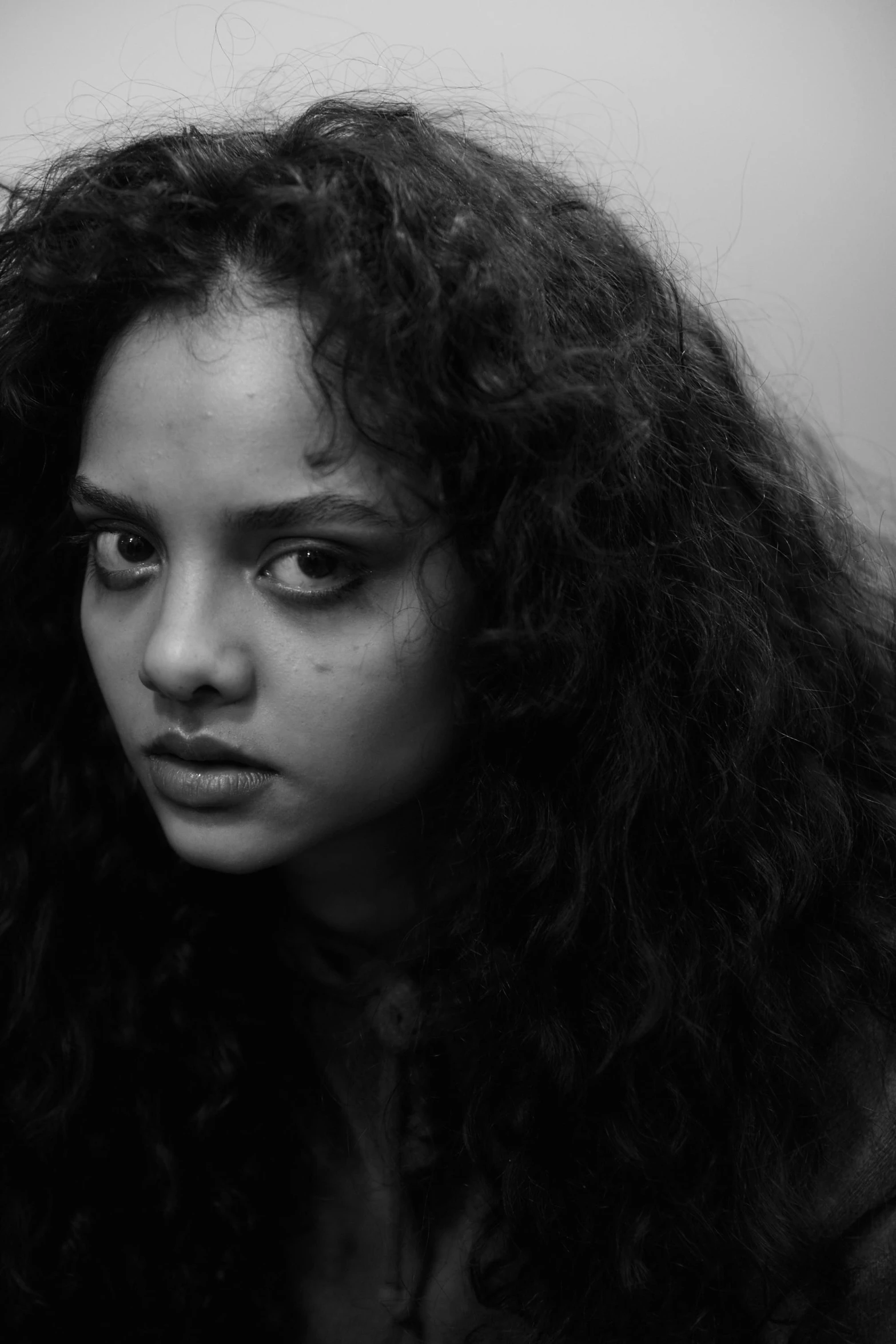 a black and white photo of a woman with long hair, inspired by Kati Horna, tessa thompson, black eyes and large forehead, saadane afif, square