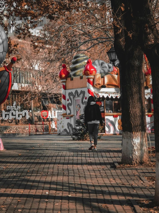 a person riding a skateboard down a sidewalk, a picture, by Julia Pishtar, pexels contest winner, graffiti, candy forest, an amusement park in old egypt, red trees, decorations