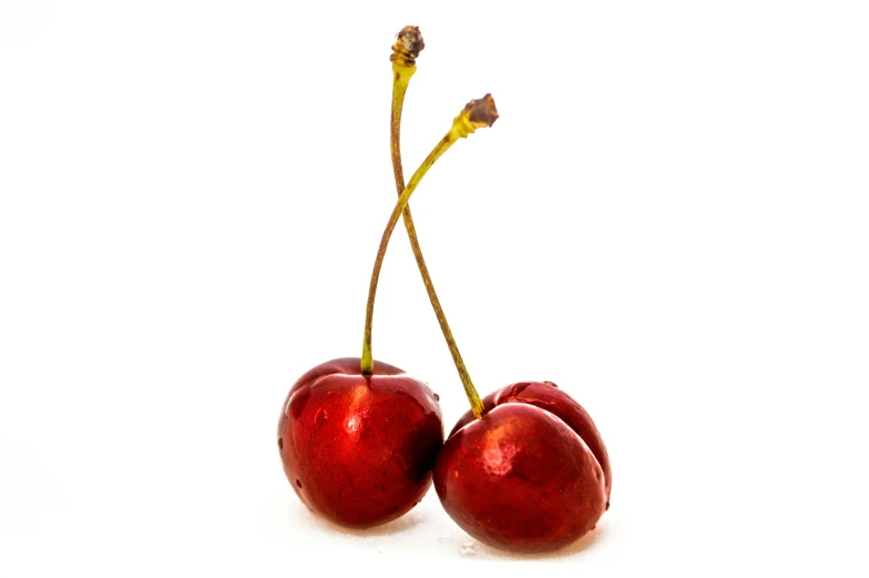 two cherries sitting next to each other on a white surface, profile image, highly upvoted, official product photo, wet