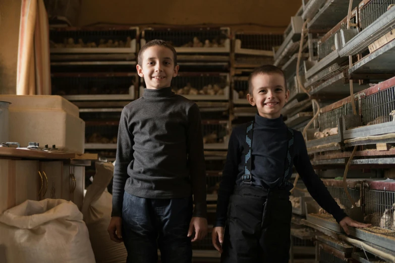 a couple of young boys standing next to each other, by Matthias Stom, pexels contest winner, renaissance, chickens, avatar image, reza afshar, small manufacture