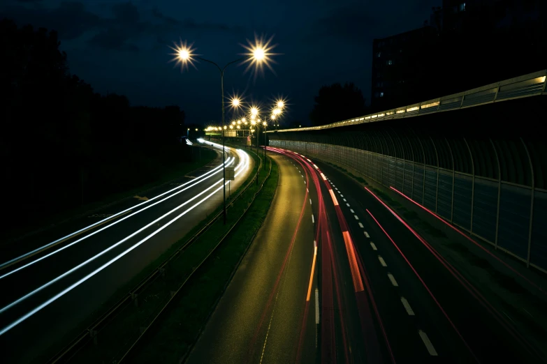a city street filled with lots of traffic at night, by Thomas Häfner, unsplash contest winner, graffiti, speed lines, highway, thumbnail, taken on a 2010s camera