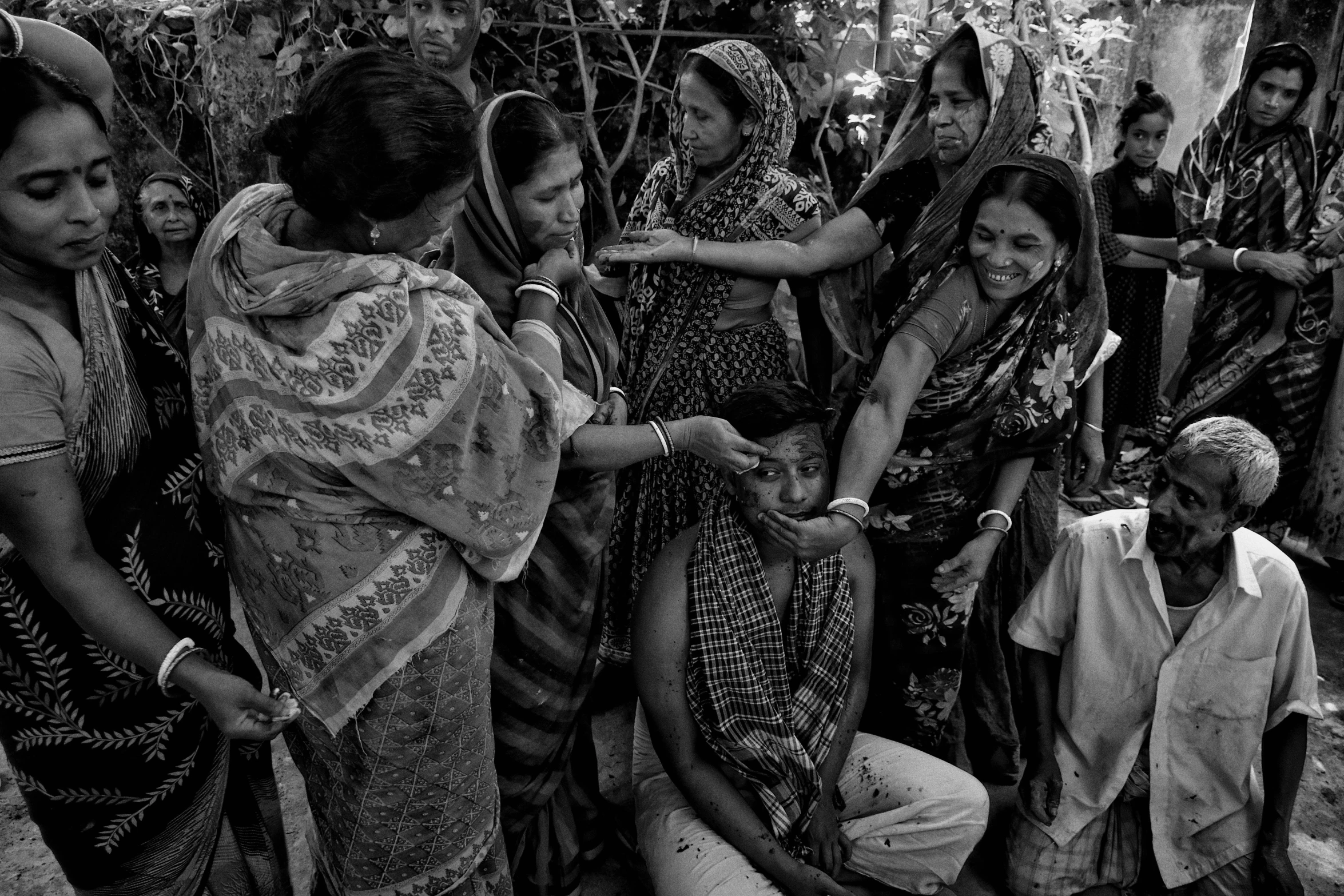 a group of women standing next to each other, a black and white photo, by Rajesh Soni, samikshavad, praying with tobacco, celebrating a king being crowned, injured, lush nature