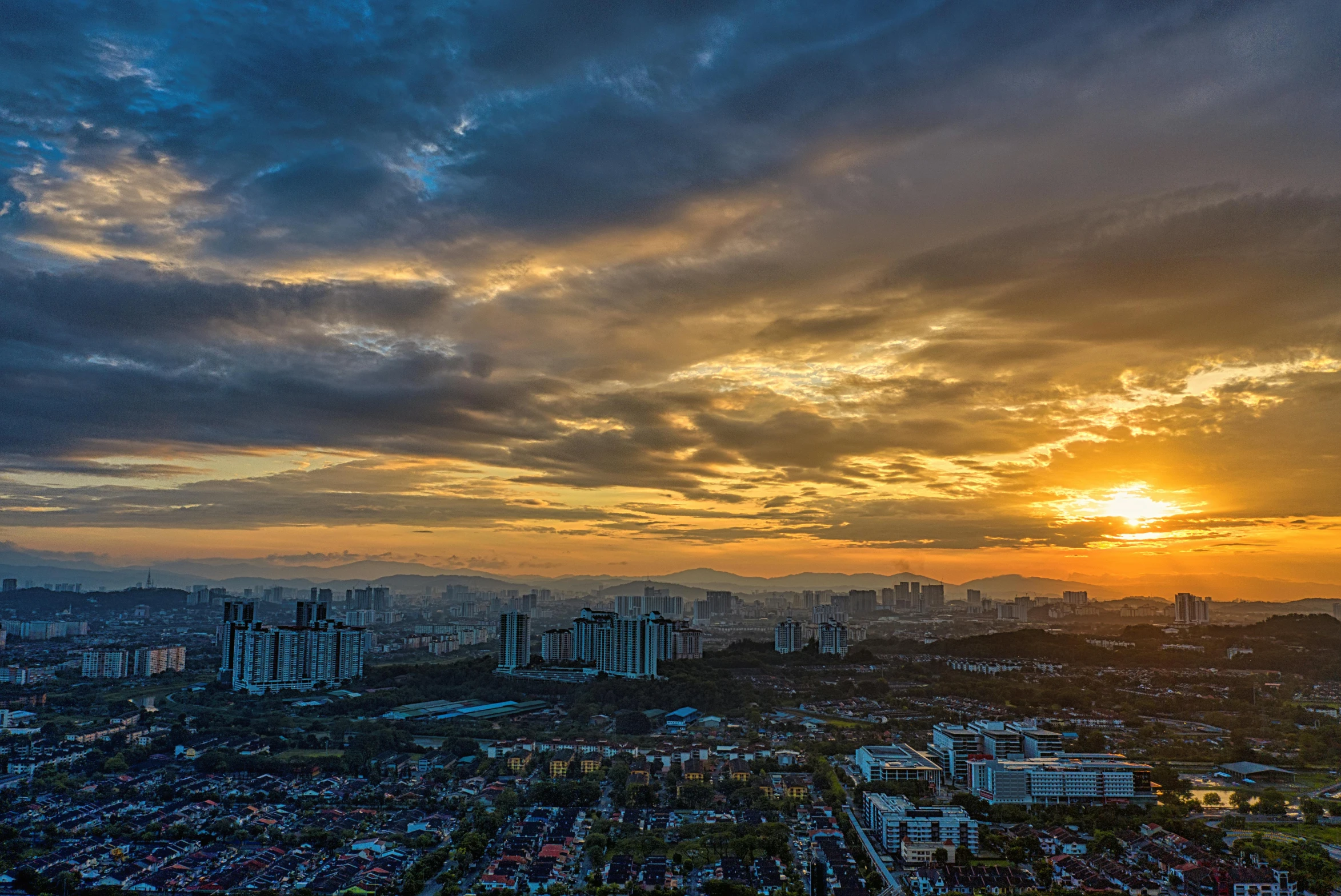 an aerial view of a city at sunset, by Joseph Severn, pexels contest winner, sumatraism, panorama view of the sky, malaysian, slide show, with dramatic sky