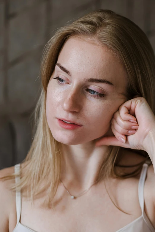 a woman sitting in front of a laptop computer, a character portrait, by Anna Boch, trending on pexels, chiseled jawline, delicate soft hazy lighting, blonde swedish woman, thoughtful )