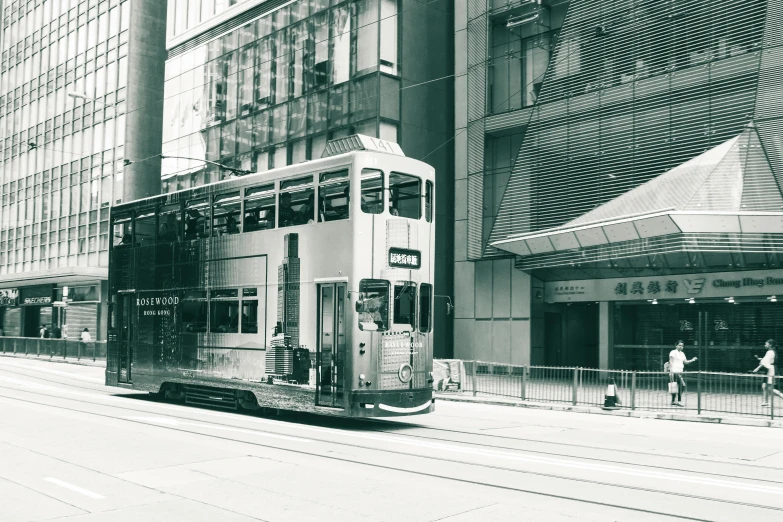 a black and white photo of a double decker bus, a black and white photo, pexels contest winner, hyperrealism, hong kong buildings, street tram, 1990s photograph, 🚿🗝📝