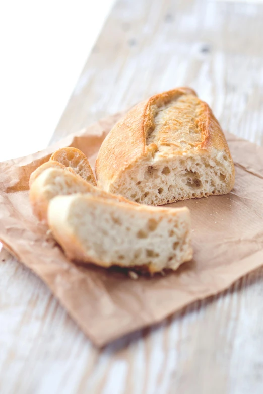 a piece of bread sitting on top of a piece of paper, listing image