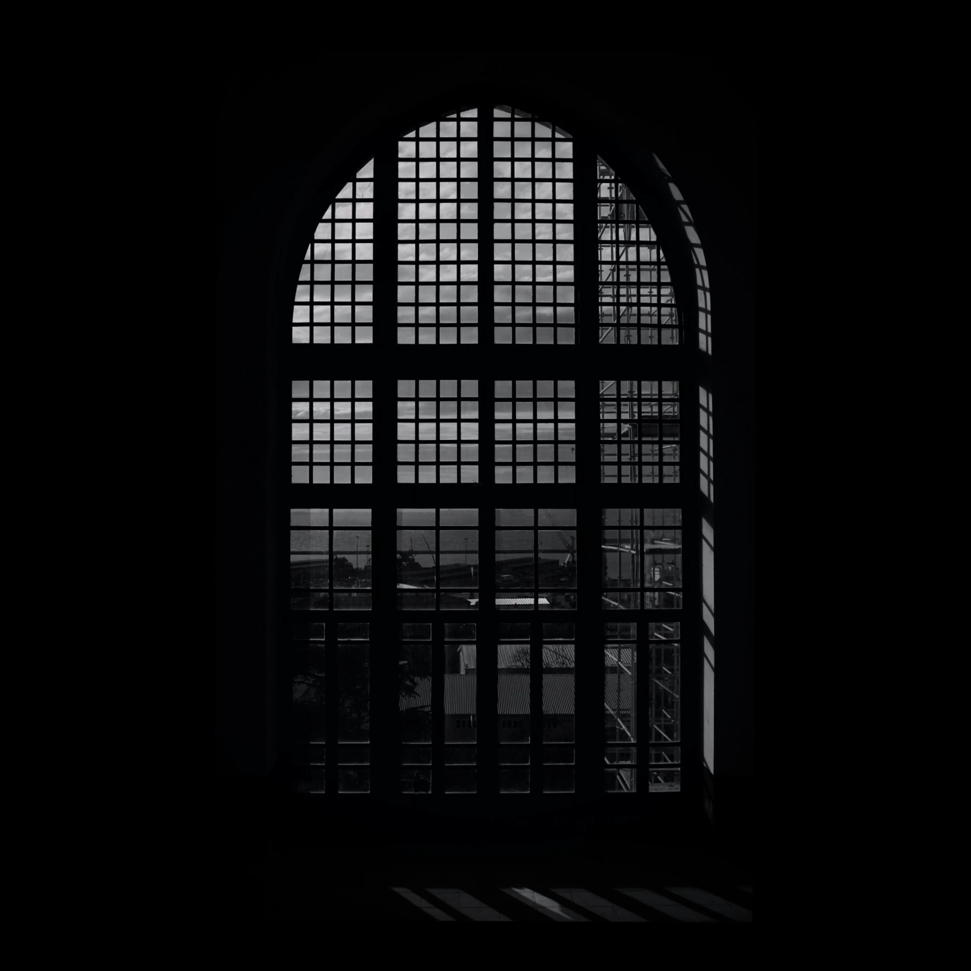 a black and white photo of a window, by Jacob Toorenvliet, unsplash contest winner, conceptual art, gothic library, 2 5 6 x 2 5 6, dark warehouse, 80s interior with arched windows