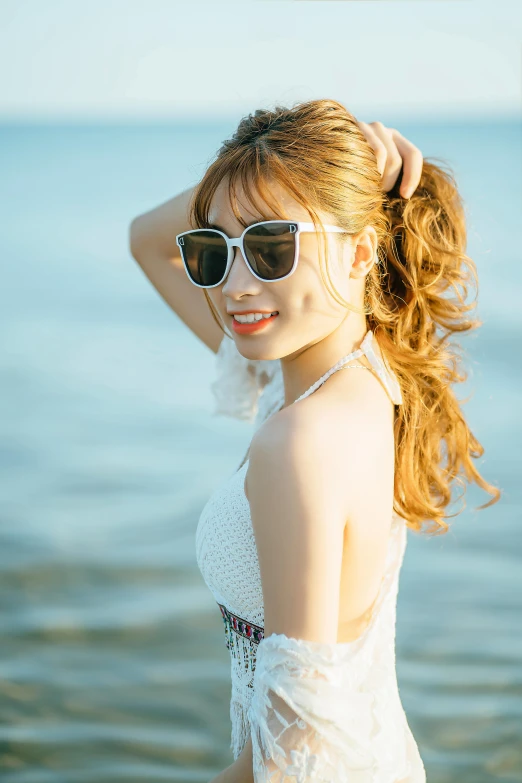 a woman that is standing in the water, a picture, unsplash, shin hanga, in sun glasses, beautiful portrait of nami, rin, profile image