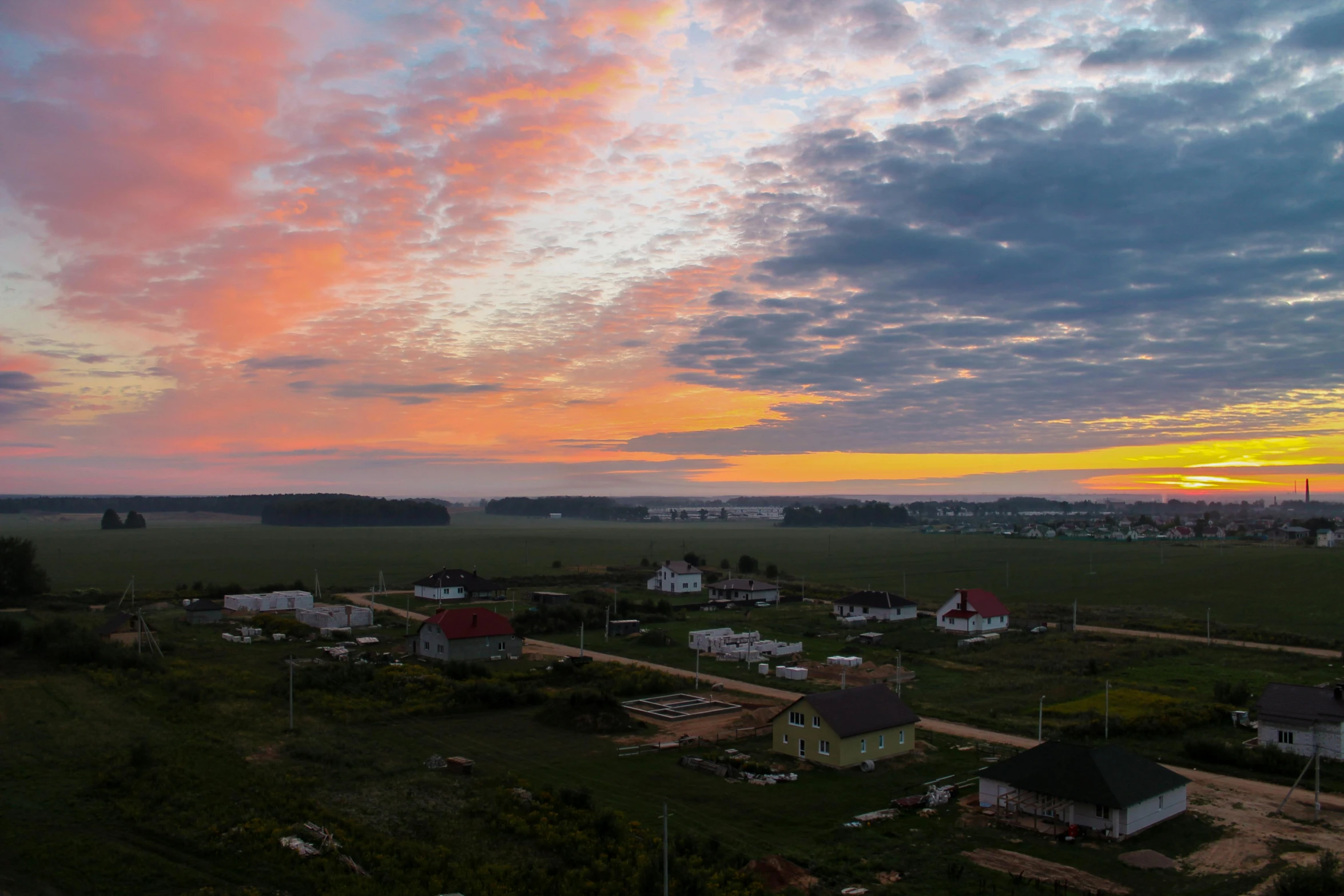 an aerial view of a small town at sunset, by Alexander Runciman, notan, vacation photo, ultrawide image, views to the ocean