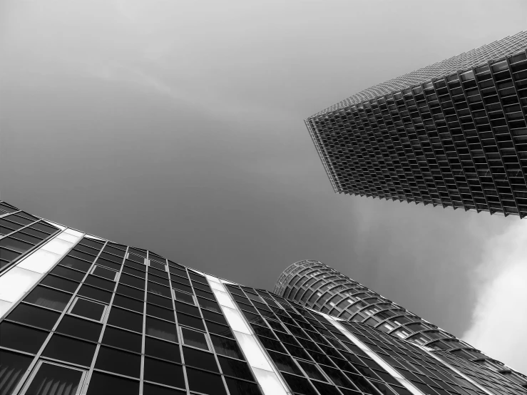 a black and white photo of some very tall buildings, by Sven Erixson, pexels contest winner, square lines, two organic looking towers, high quality picture, glass and steel