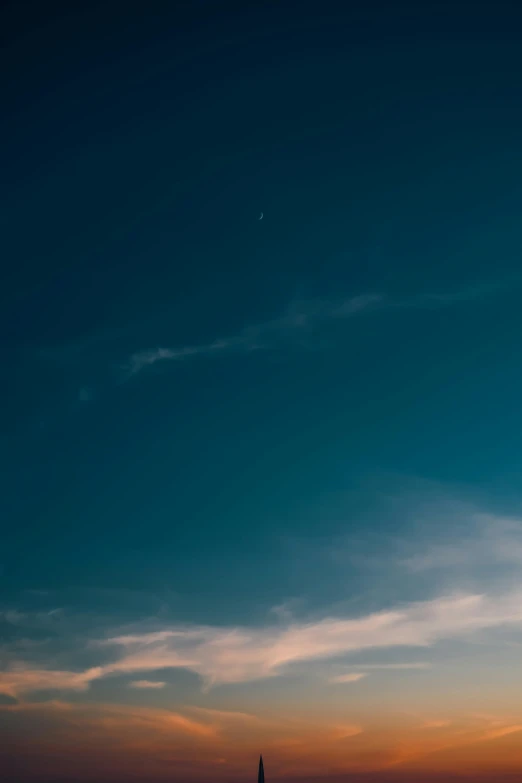 an airplane flying over a body of water at sunset, a picture, unsplash, minimalism, soft blue moonlight, cinematic shot ar 9:16 -n 6 -g, stars and moons in the sky, aesthetic clouds in the sky