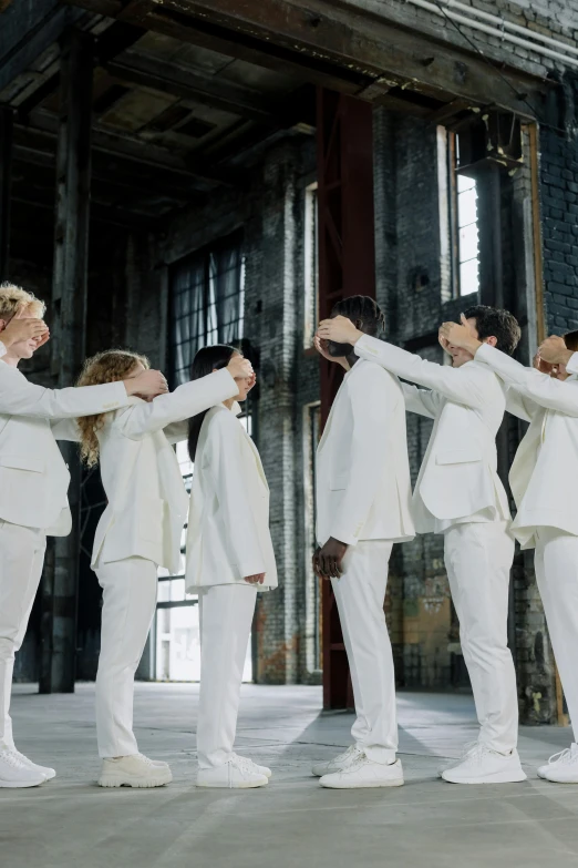 a group of people in white suits standing next to each other, by Nina Hamnett, renaissance, reaching out to each other, performing a music video, in a row, embracing