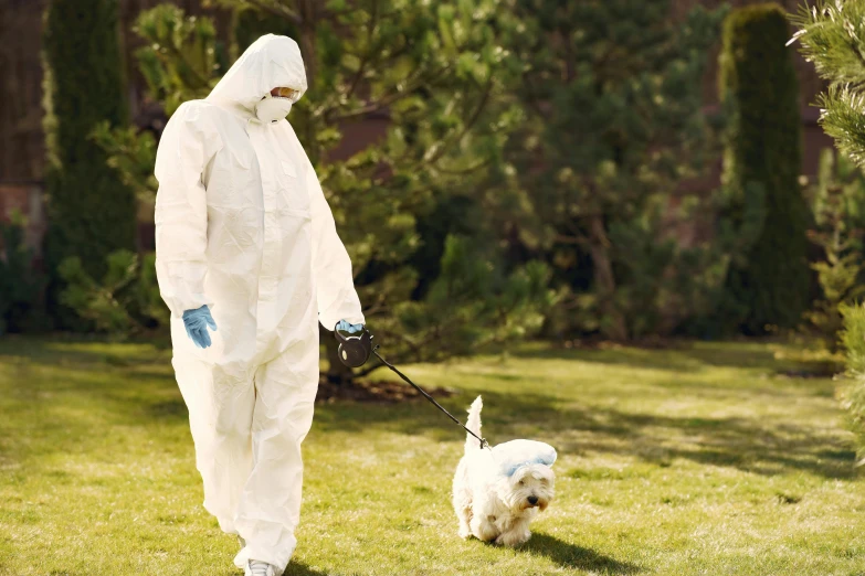 a man in a protective suit walking a dog, pexels, renaissance, wearing lab coat and a blouse, homicide, lawn, wearing a track suit