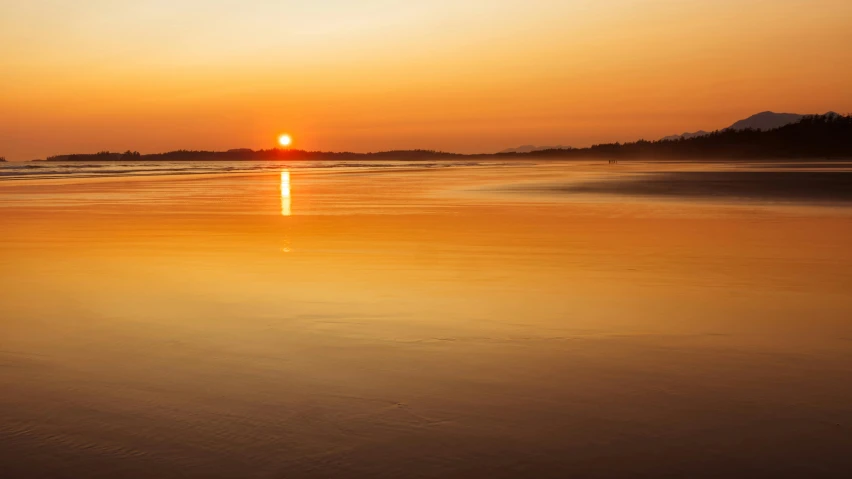 the sun is setting over the water on the beach, by Andrew Geddes, vibrant orange, golden hour photograph, with a brilliant