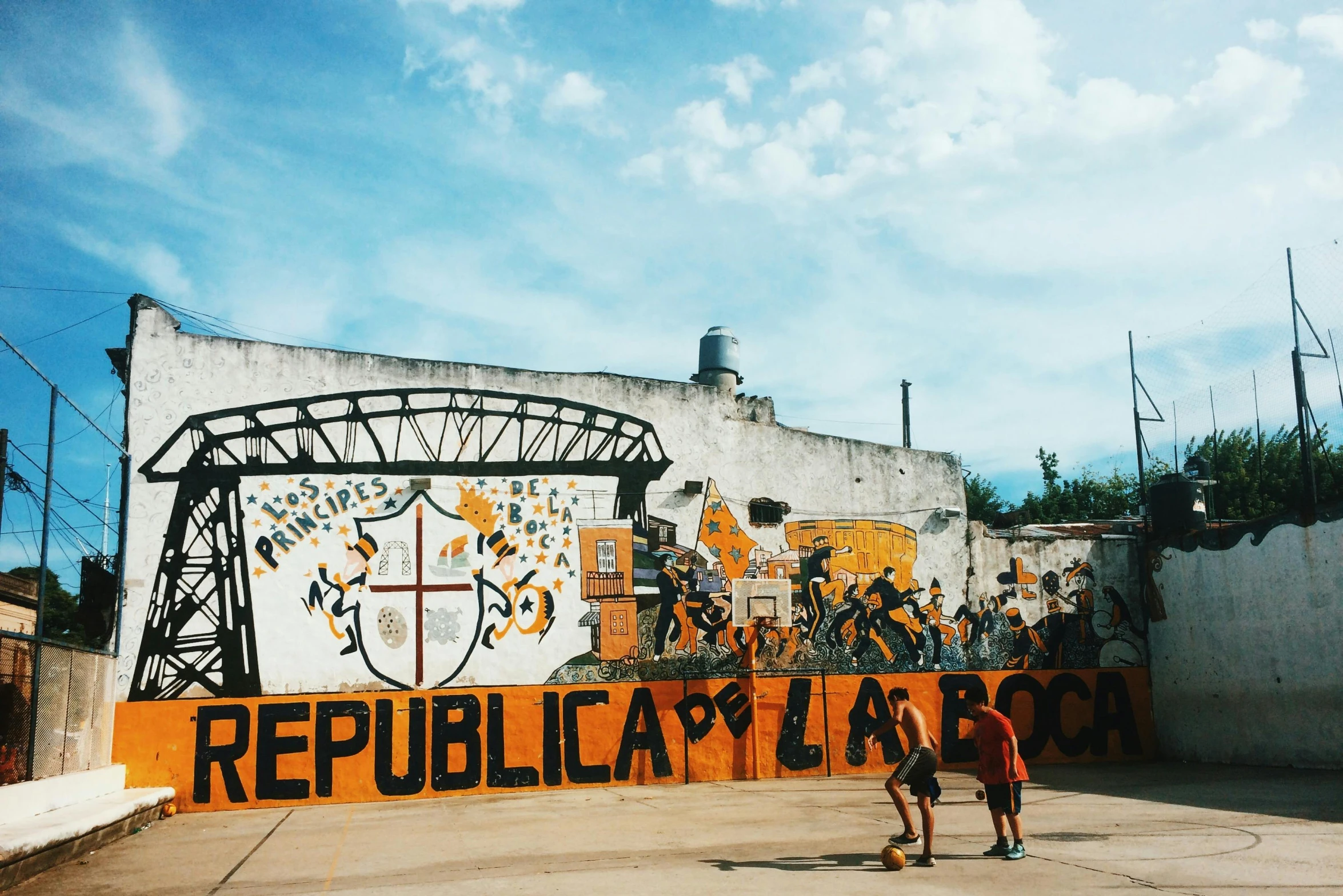 a man riding a skateboard in front of a mural, by Gina Pellón, unsplash contest winner, argentina presidential rally, orange roof, football, 🚿🗝📝
