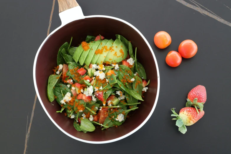 a bowl of salad with avocado and tomatoes, by Daniel Lieske, hurufiyya, coloured in teal and orange, high quality product image”, red caviar instead of sand, various posed