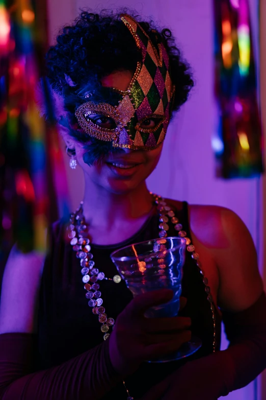 a woman wearing a mask and holding a glass, colorful lights, brightly lit purple room, decorations, ( ( dark skin ) )