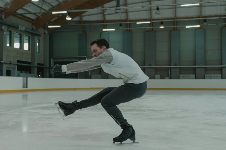 a man riding a skateboard on top of an ice rink, inspired by Nils Hamm, arabesque, 8 k movie still, full dynamic colour, promotional image, stillframe