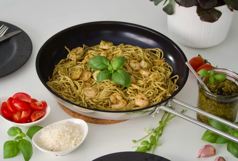 a pan filled with pasta sitting on top of a table, detailed product image, botanicals, tungsten, sparkling