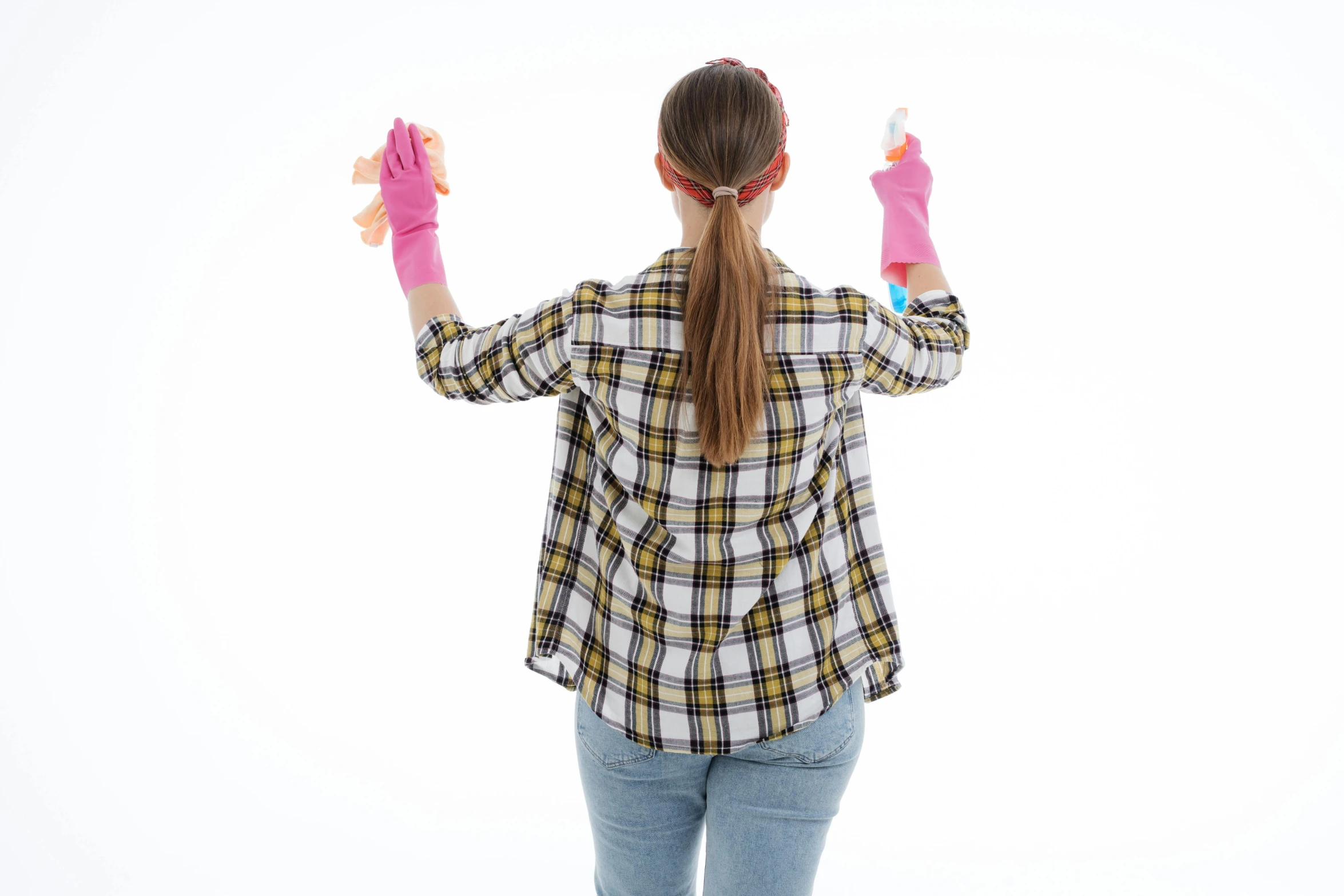 a woman in a plaid shirt and pink gloves, yellow latex gloves, back facing, cleaned up, upper body image