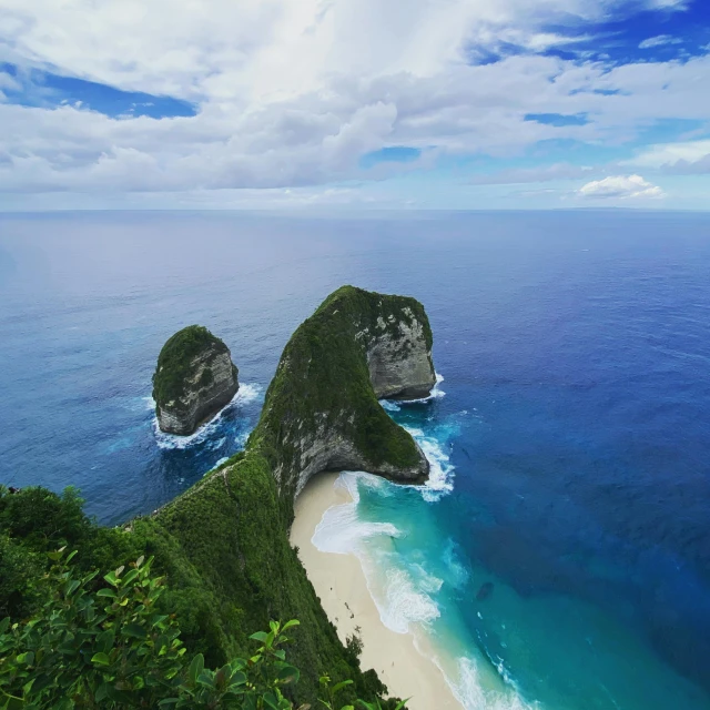 two large rocks in the middle of a body of water, by Daniel Lieske, pexels contest winner, sumatraism, ocean cliff view, square, coban, slide show