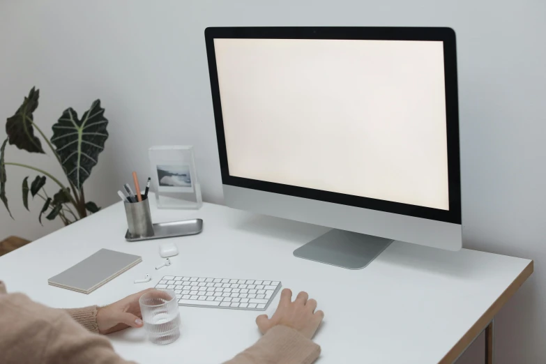 a person sitting at a desk using a computer, trending on pexels, white lighting, background is white and blank, avatar image, 9 9 designs