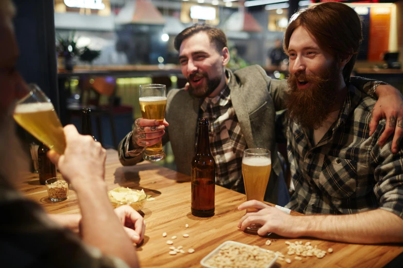 a group of men sitting around a wooden table, pexels, beer in hand, avatar image, bearded, recreation