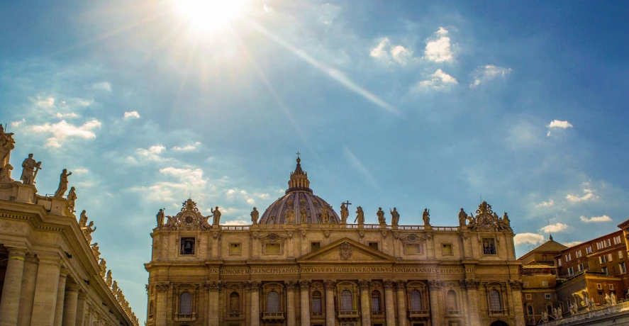 the sun shines brightly behind the dome of st peter's basilica, pexels contest winner, neoclassicism, blue sky, brown, summer sunlight, conde nast traveler photo