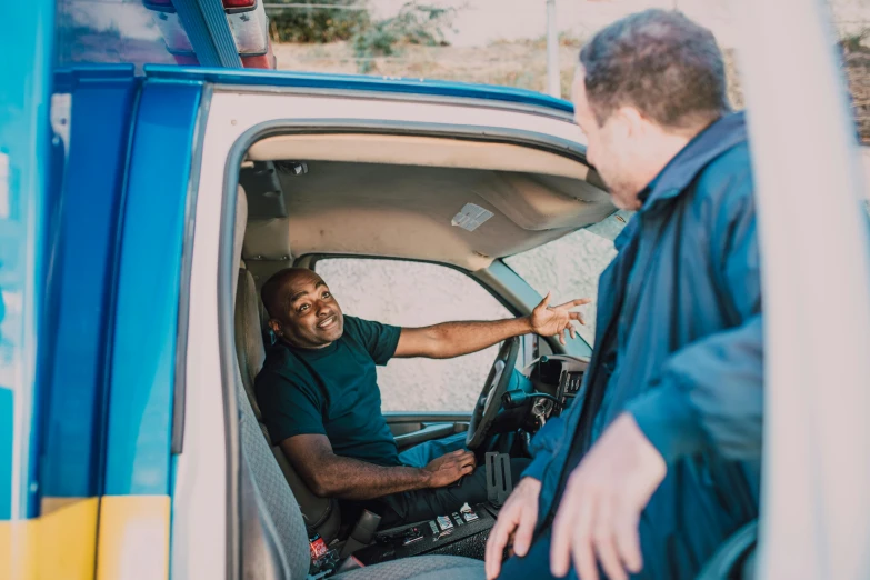 a man sitting in the driver's seat of a truck, pexels contest winner, happening, laughing menacingly, police officers, avatar image, diverse