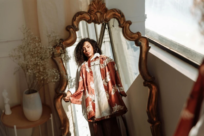 a woman standing in front of a mirror, by Nina Hamnett, trending on pexels, baroque, wearing a haori, sza, caramel, vanessa morgan