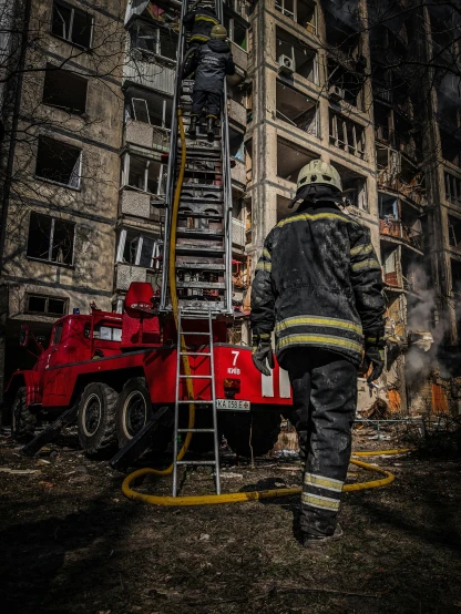 a fireman standing on a ladder in front of a building, a photo, by Adam Marczyński, pexels contest winner, auto-destructive art, war in ukraine, kremlin towers are destroyed, 15081959 21121991 01012000 4k, full frame image