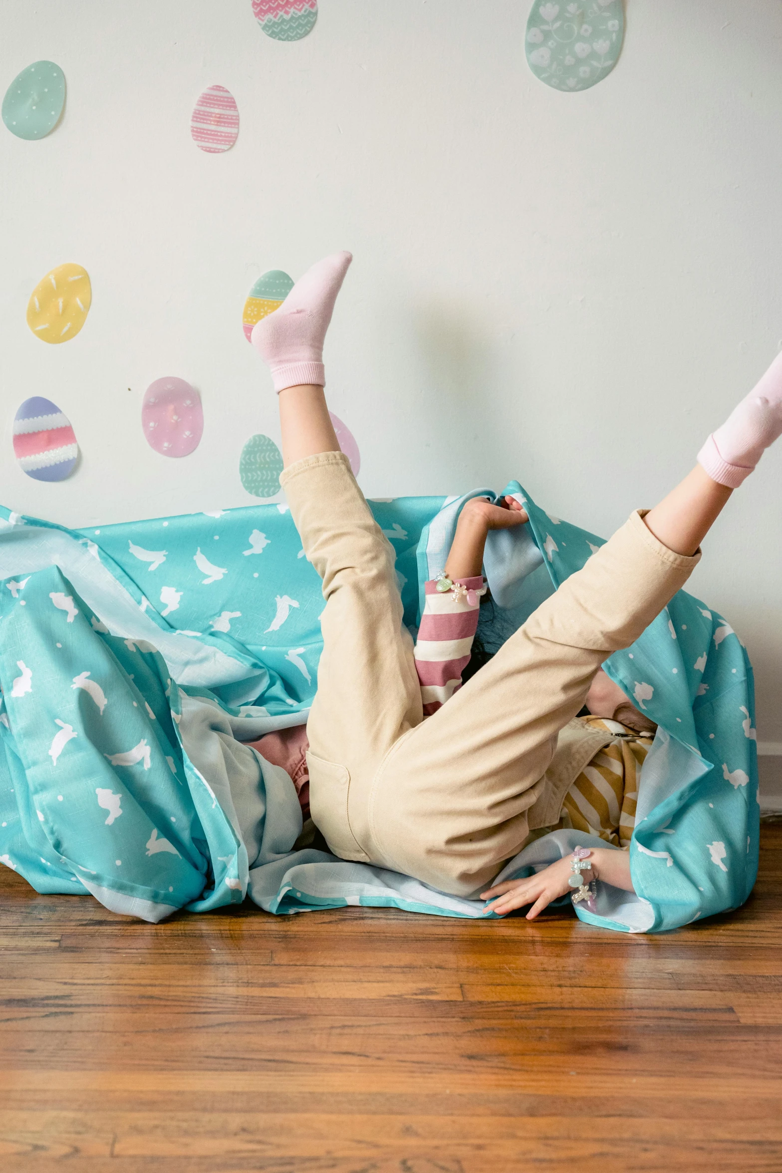 a little girl laying on her stomach on the floor, shutterstock contest winner, happening, with an easter basket, with a bunk bed, ripped fabric, leaping with arms up