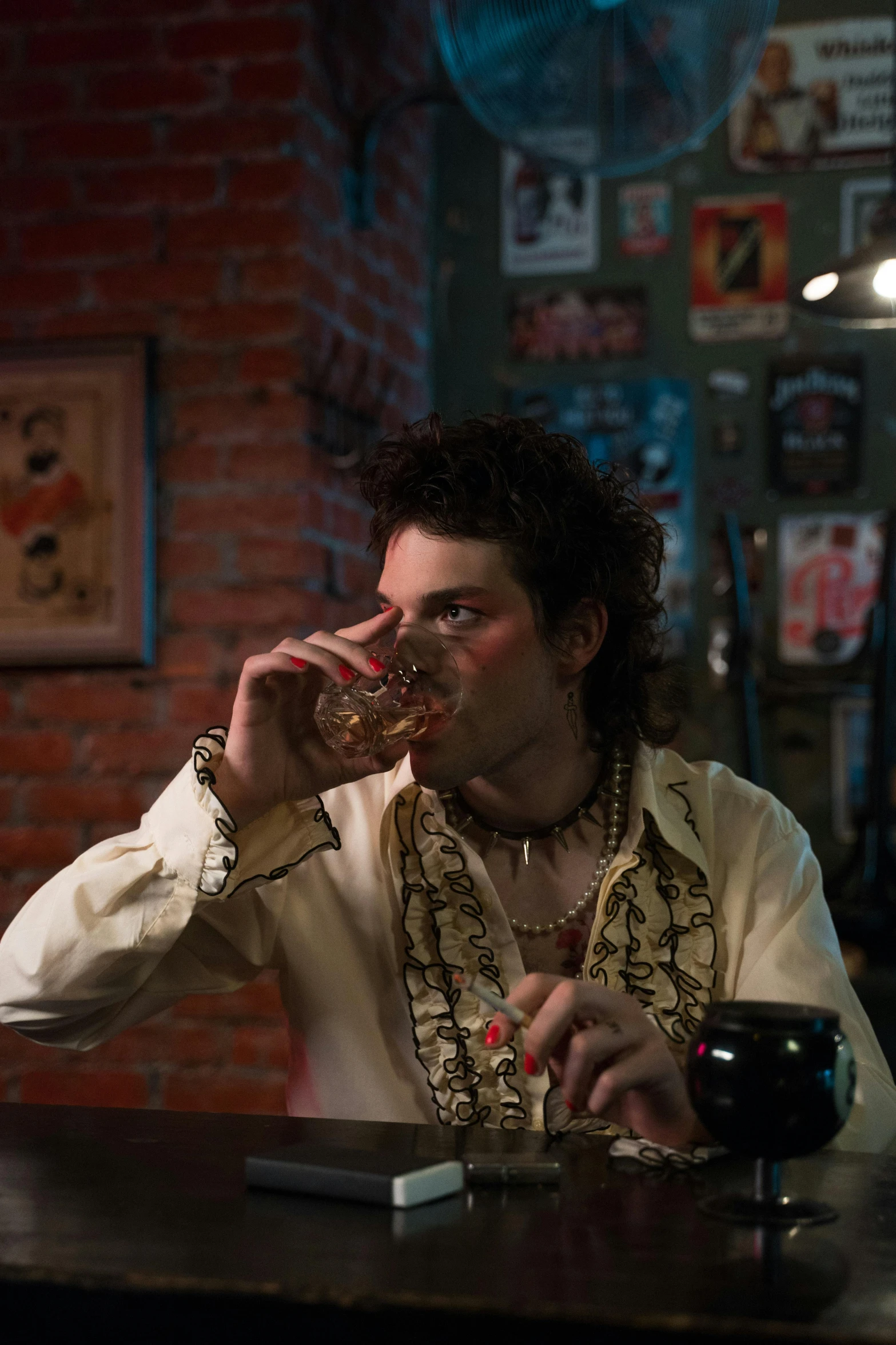 a man sitting at a bar drinking a glass of wine, an album cover, by Adam Dario Keel, pexels, renaissance, jean deville, movie still, paisley, getting his tacos and drink)