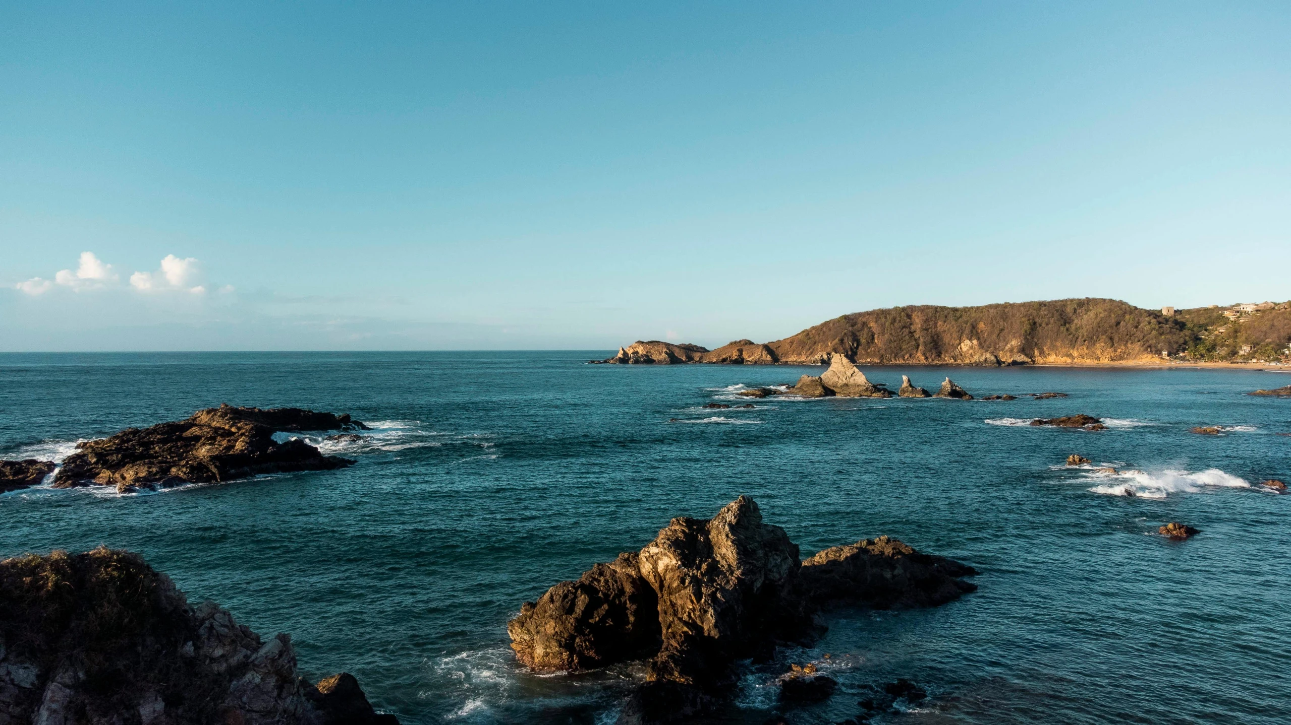 a body of water that has some rocks in it, by Lee Loughridge, pexels contest winner, les nabis, picton blue, overlooking the ocean, florence pugh, chile