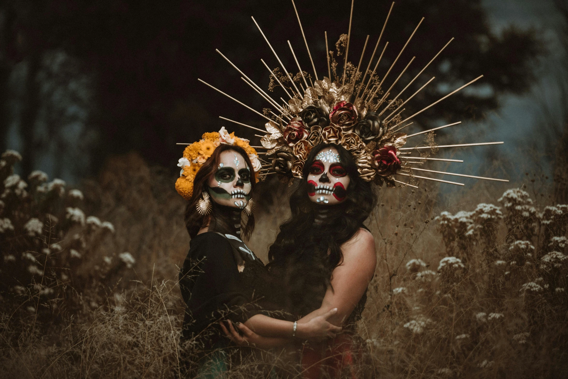 a couple of people that are standing in the grass, pexels contest winner, lowbrow, el dia los muertos, beautiful gemini twins, bronze headdress, avatar image