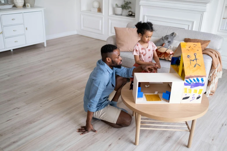 a man and a little girl sitting on a couch, a child's drawing, pexels contest winner, tabletop model buildings, white and yellow scheme, doll house, geometric