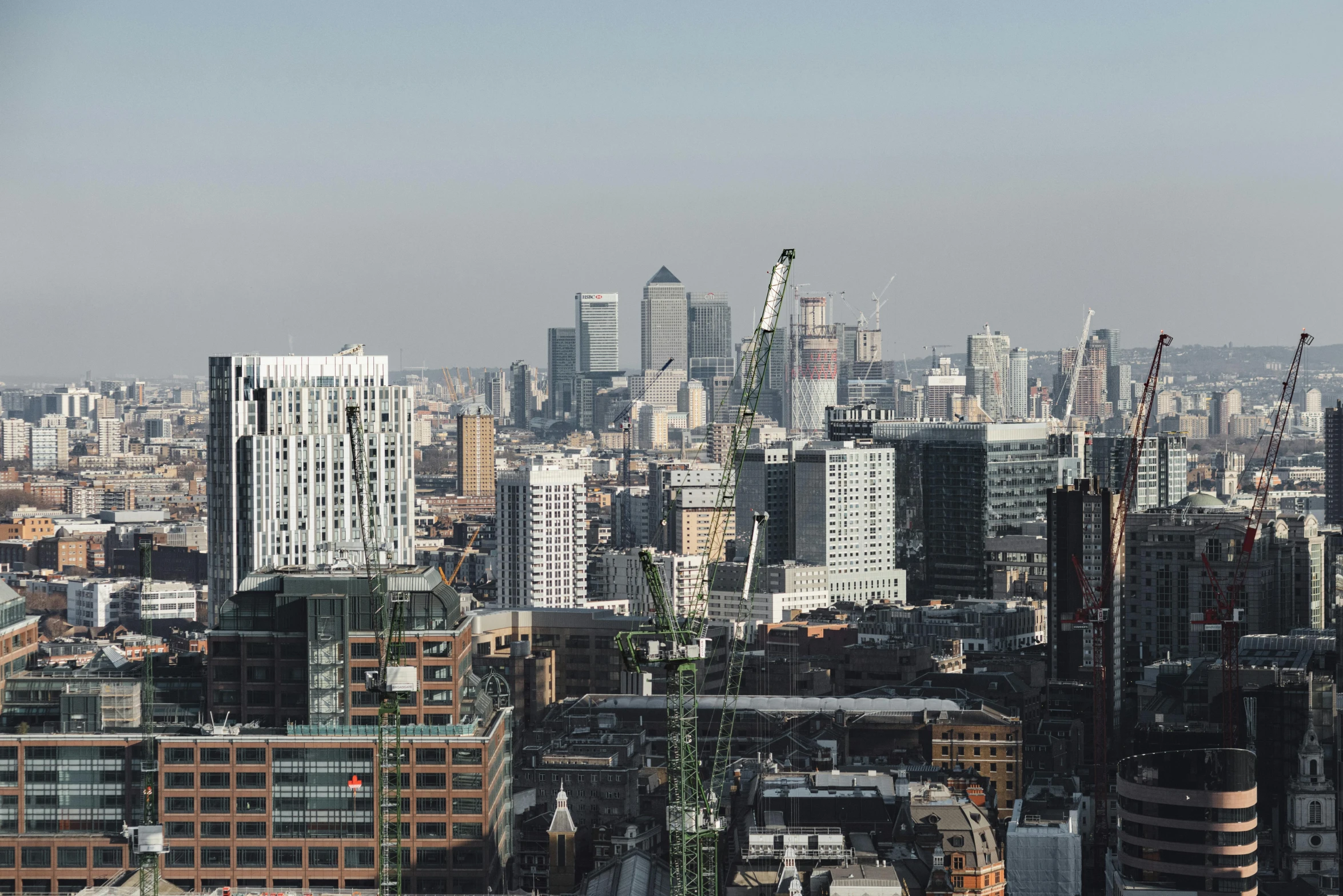 a view of a city from the top of a building, inspired by Thomas Struth, unsplash contest winner, brutalism, canary wharf, slightly sunny weather, 8k resolution”, 2 0 0 0's photo