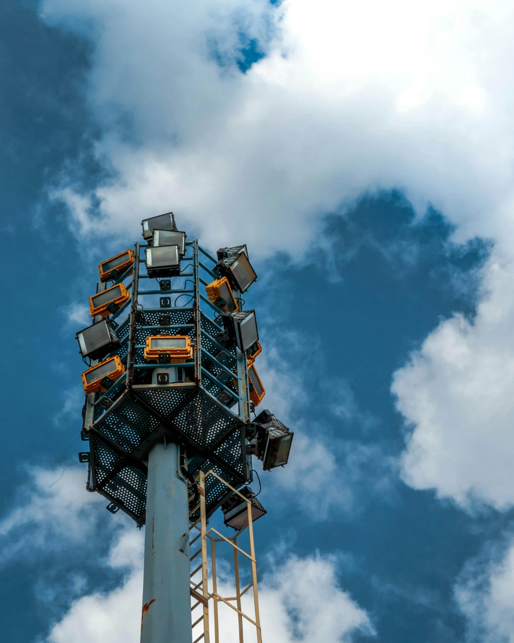 a tall tower sitting under a cloudy blue sky, unsplash contest winner, led floodlights, lgbtq, jc park, search lights