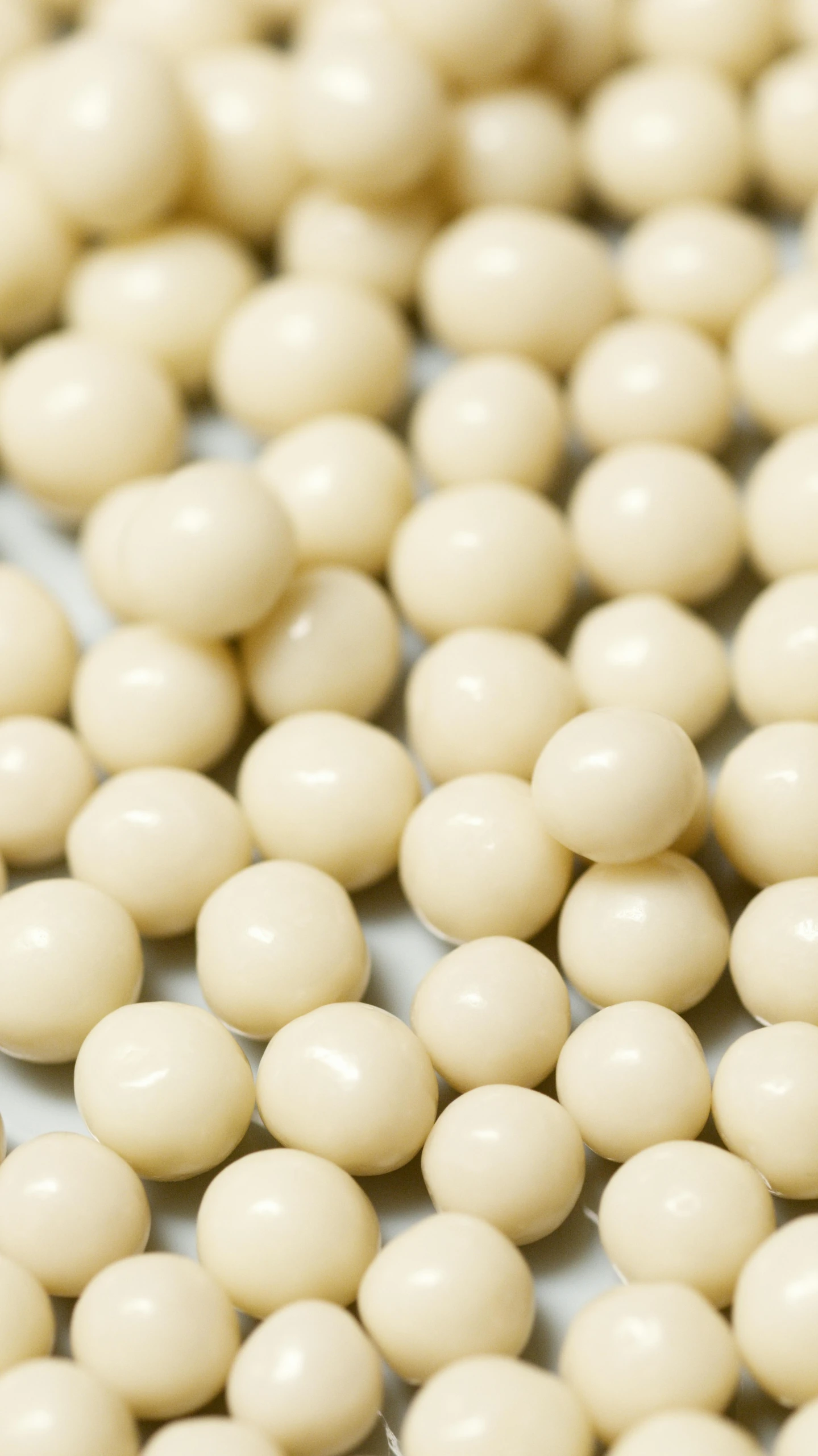 a pile of white beads sitting on top of a table, chocolate, thumbnail, creamy, h 1088