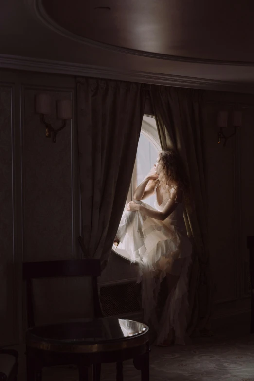 a woman in a wedding dress looking out a window, inspired by Anka Zhuravleva, unsplash contest winner, rococo, spirits covered in drapery, hotel room, sensual dancing, ( ( theatrical ) )