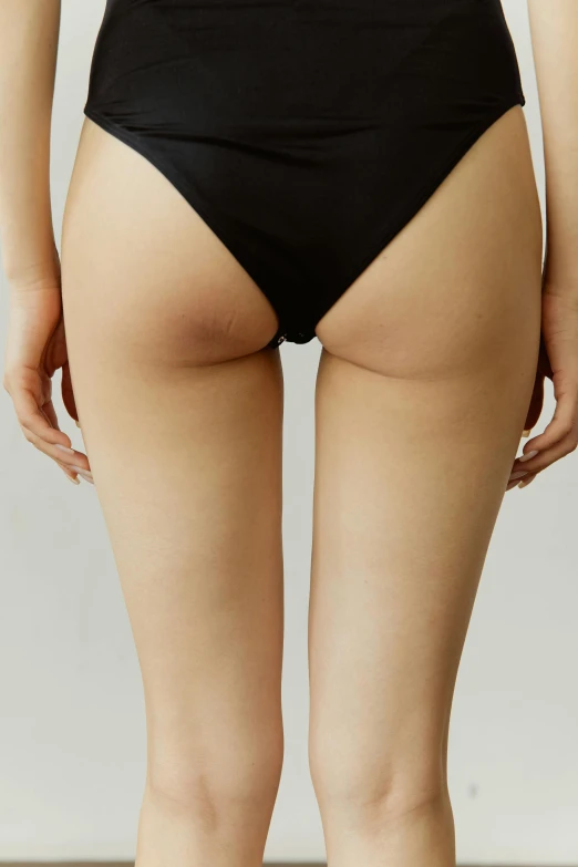 the back of a woman in a black bikini, by Nina Hamnett, dribble, smooth textured skin, zoomed out view, cream, blackout