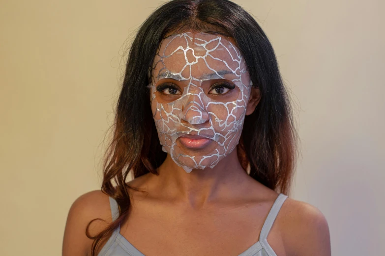a woman with white paint on her face, voronoi, light-brown skin, see through glass hologram mask, charcoal color skin