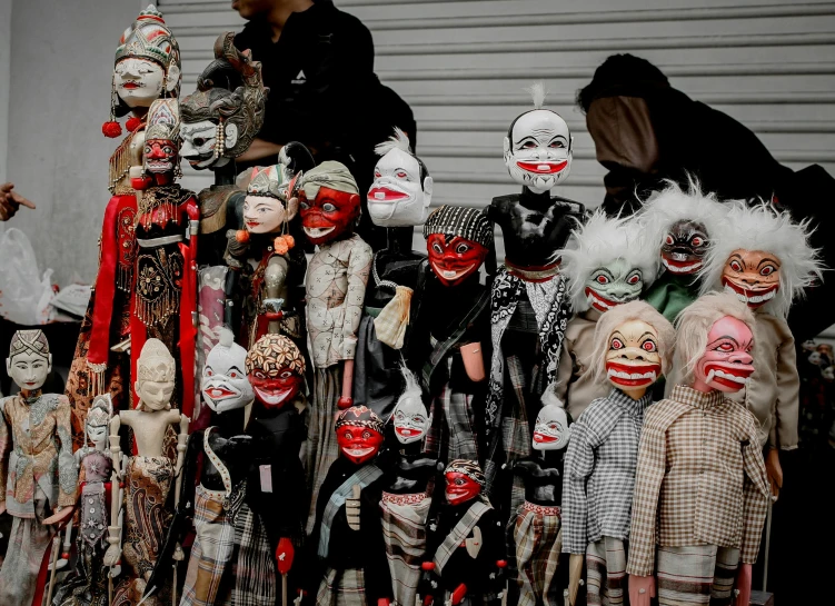 a group of puppets sitting on top of a table, by Ingrida Kadaka, pexels contest winner, toyism, old japanese street market, tribal masks, halloween, profile image