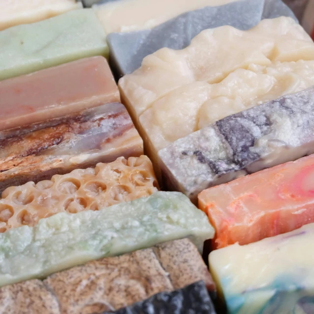 a bunch of soap bars sitting on top of each other, various styles, thumbnail, up-close, handmade