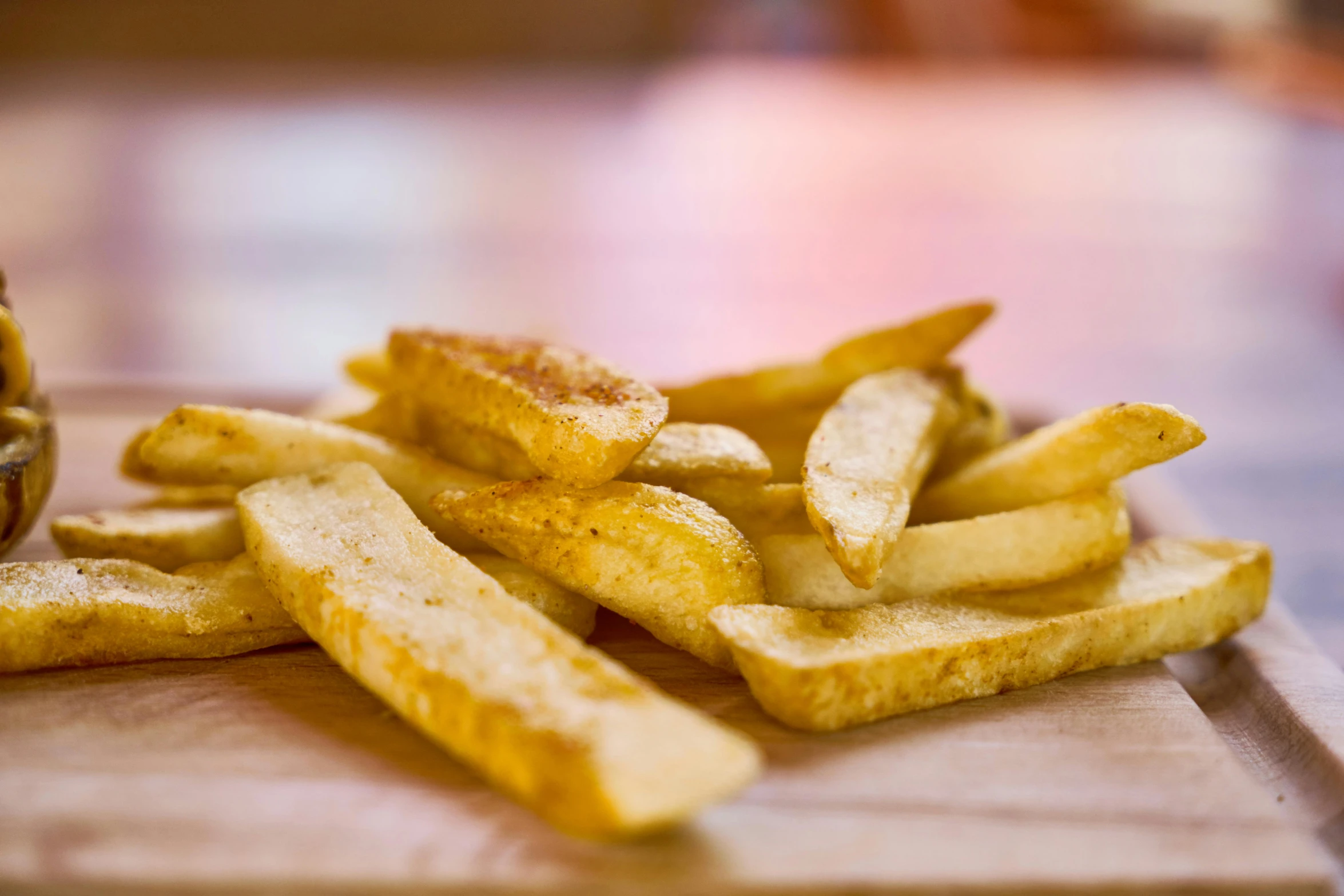 a wooden cutting board topped with french fries, thumbnail, braavos, alabama, pikes