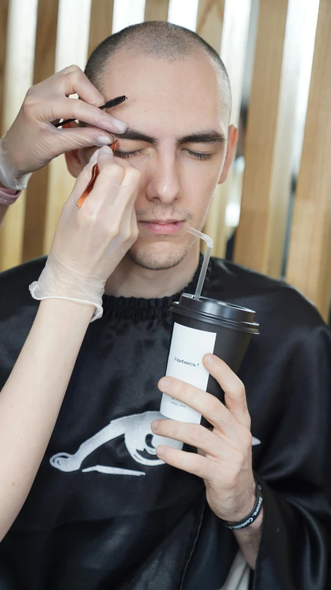 a man getting his hair cut by a woman, shutterstock, attractive man drinking coffee, white eyebrows, idealised, makeup